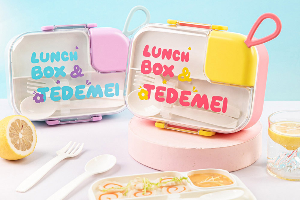 a plastic lunch box with spoons and fork